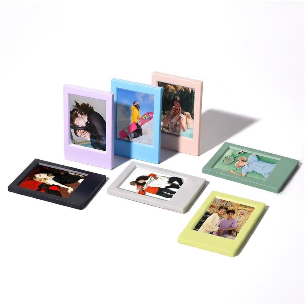 Set of colorful mini photo frames with variously styled photos inside on a white background
