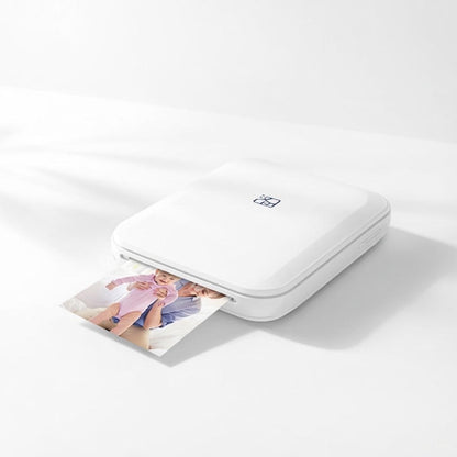 White portable photo printer on a white background